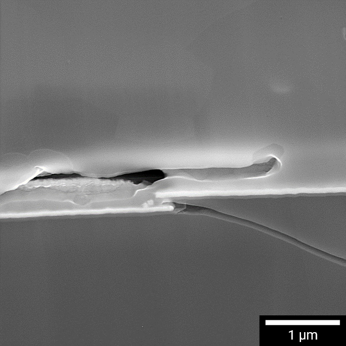 Microcracks at FIB-polished interface between solder bump and under bump metallurgy layer.