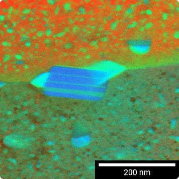 A colored STEM image showing a section of an Al alloy containing Zn and Mg, captured using a R-STEM detector at 30 keV in FIB-SEM, using a TEM lamella preparation.