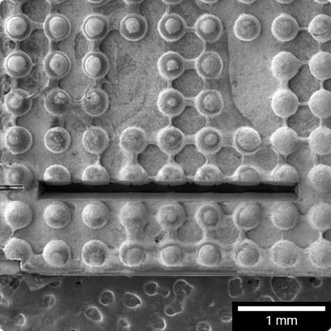 4mm cut through 7 x Ø500 μm solder balls, accomplished in 20 minutes via laser ablation.